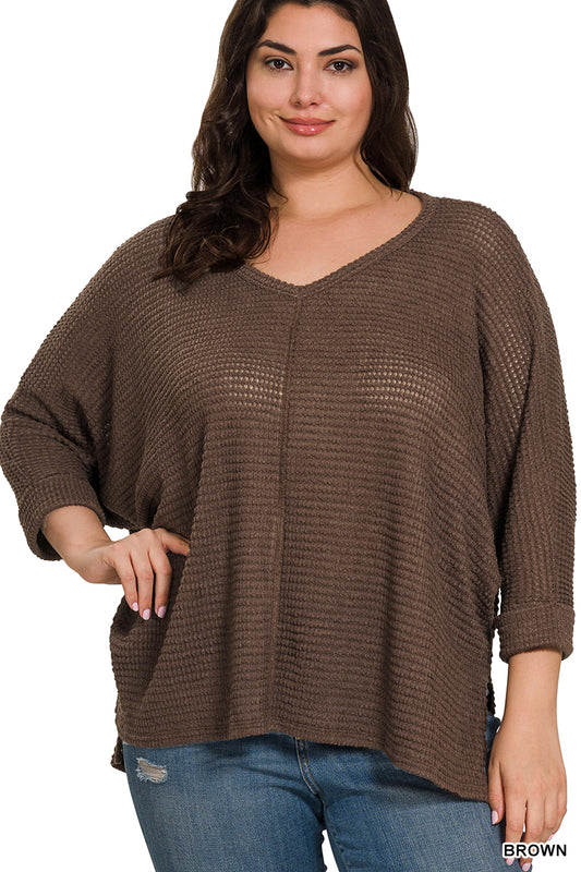 Cozy meets chic in this Plus Size 3/4 Sleeve V-Neck Jacquard Sweater